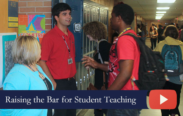 Student teacher talks with a student