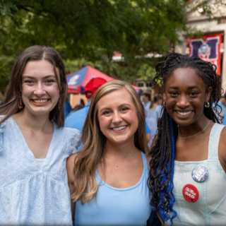 Three students pose for picture