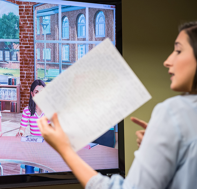 student teaches to a female avatar