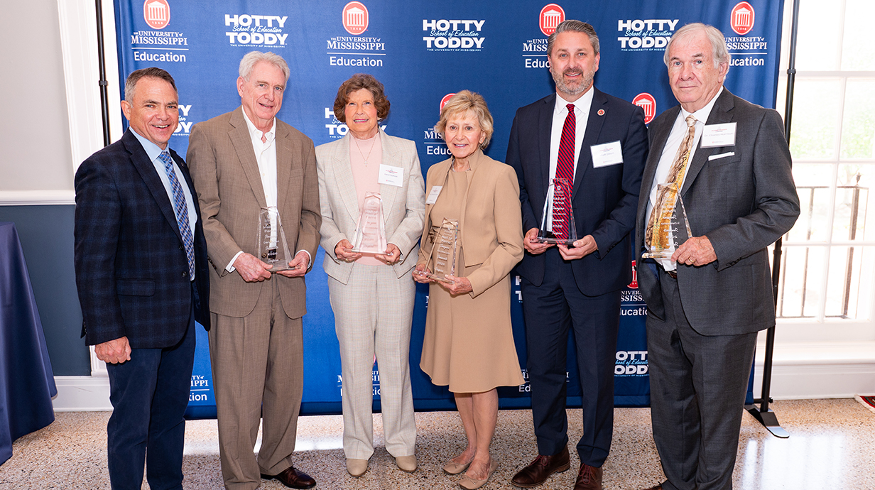 hall of fame inductees hold their awards at the 2026 School of Education Alumni Award Celebration